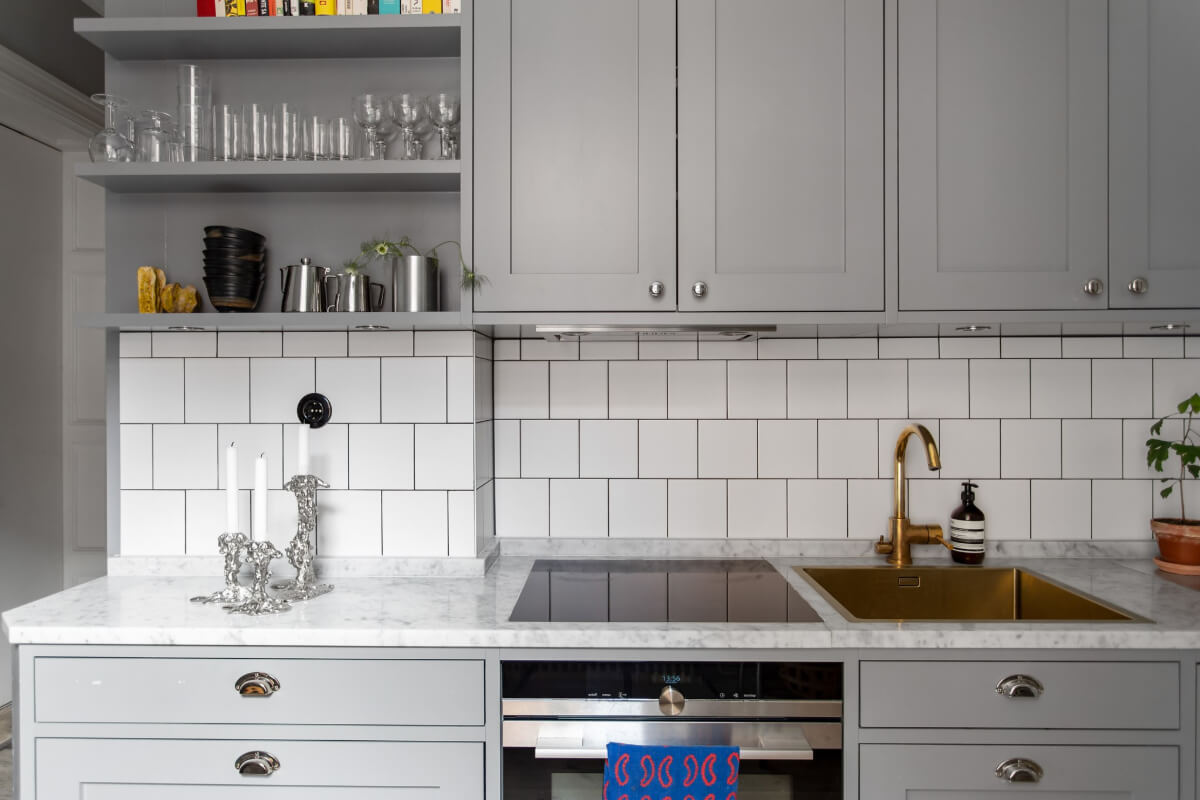 A Gray Studio Apartment with an Industrial Room Divider 12 gray kitchen shelves and white tiles