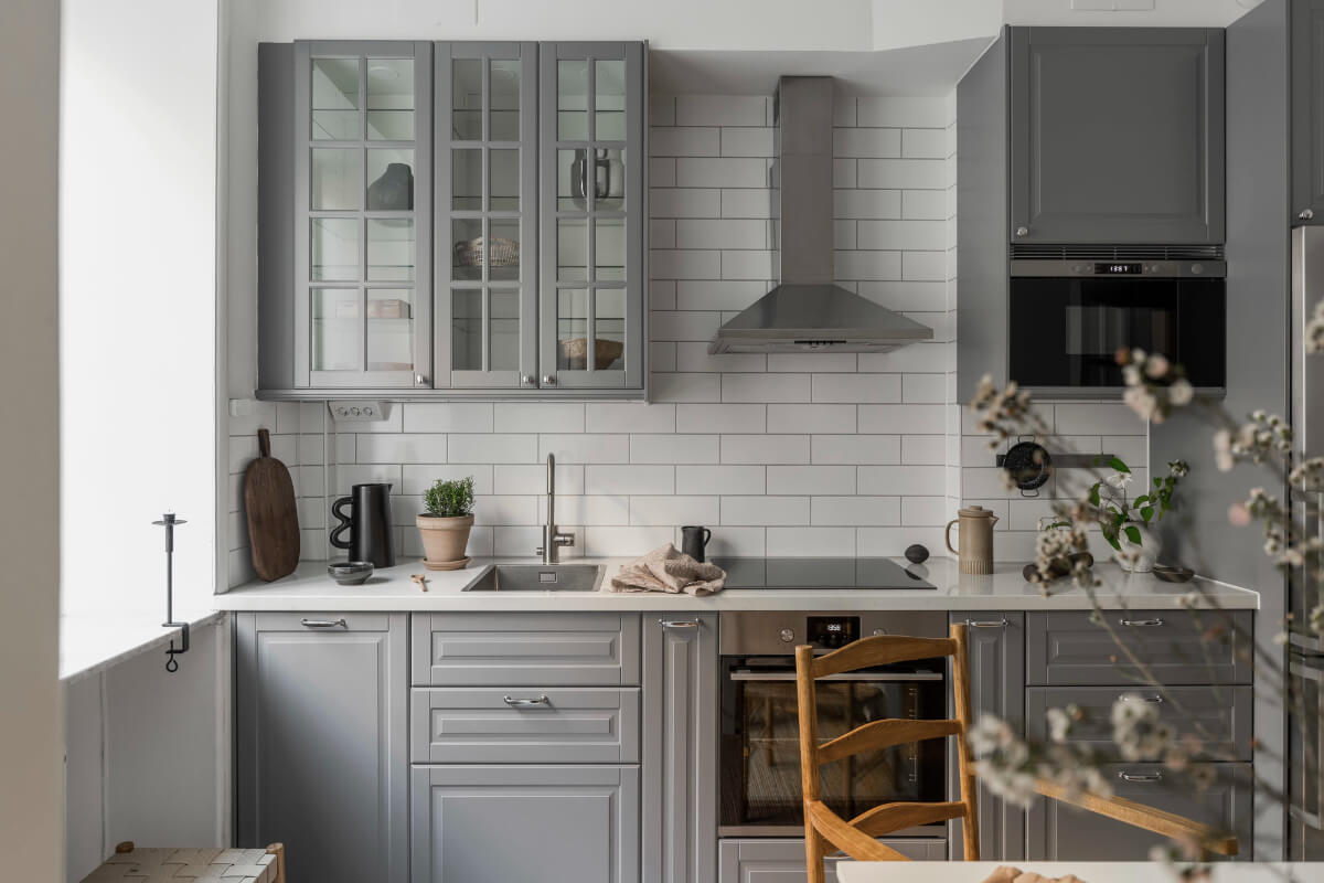 A Light Swedish Studio in an Early 20th Century Building 12 gray kitchen white tiles