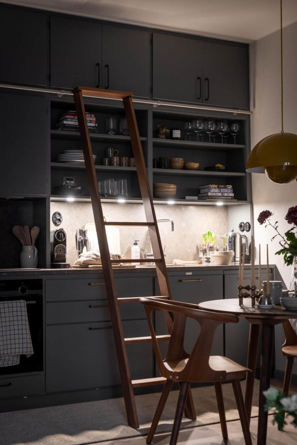 A Small Ground Floor Apartment Decorated in Gray Tones 9 gray kitchen with ladder