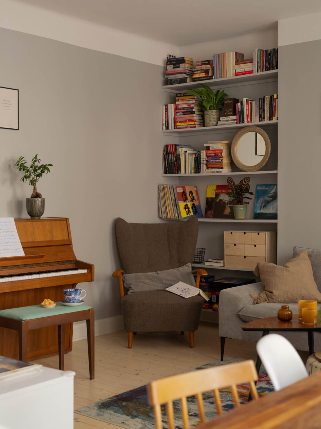 A Charming One-Bedroom Apartment in a 1920s Building 3 gray living room shelves