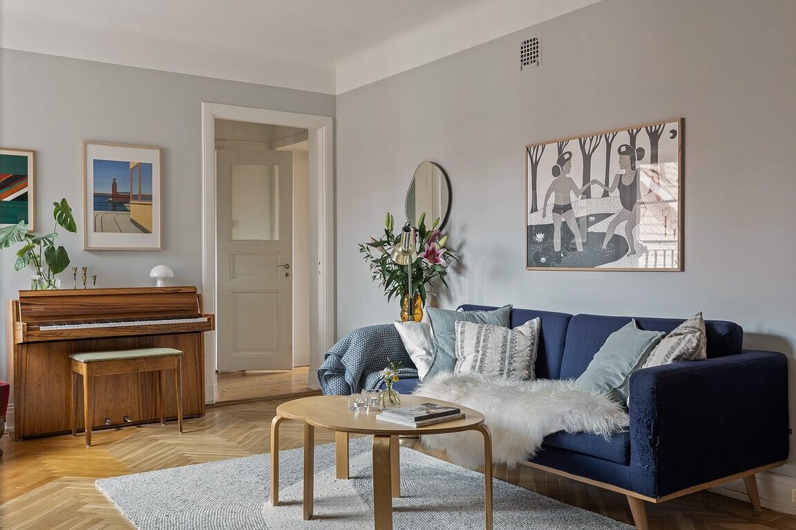 A Stockholm Apartment with a Light Yellow Kitchen 2 gray living room with piano