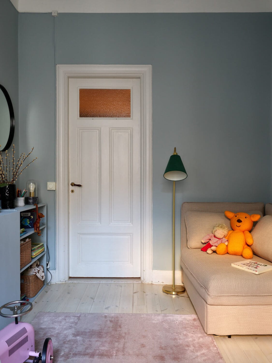 A Two-Bedroom Apartment with a Charming Bathroom 19 gray nursery with ikea ivar cabinets and corner chair