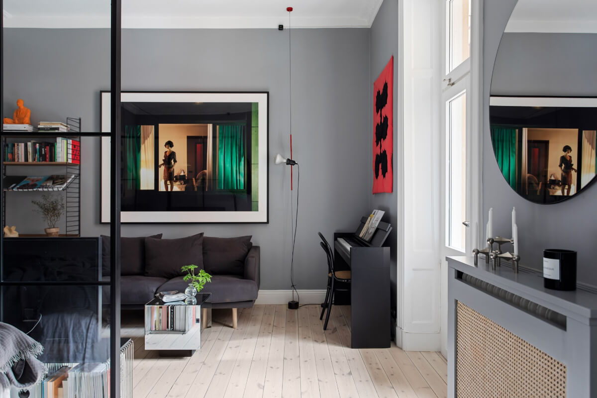 A Gray Studio Apartment with an Industrial Room Divider 2 gray studio wooden floor