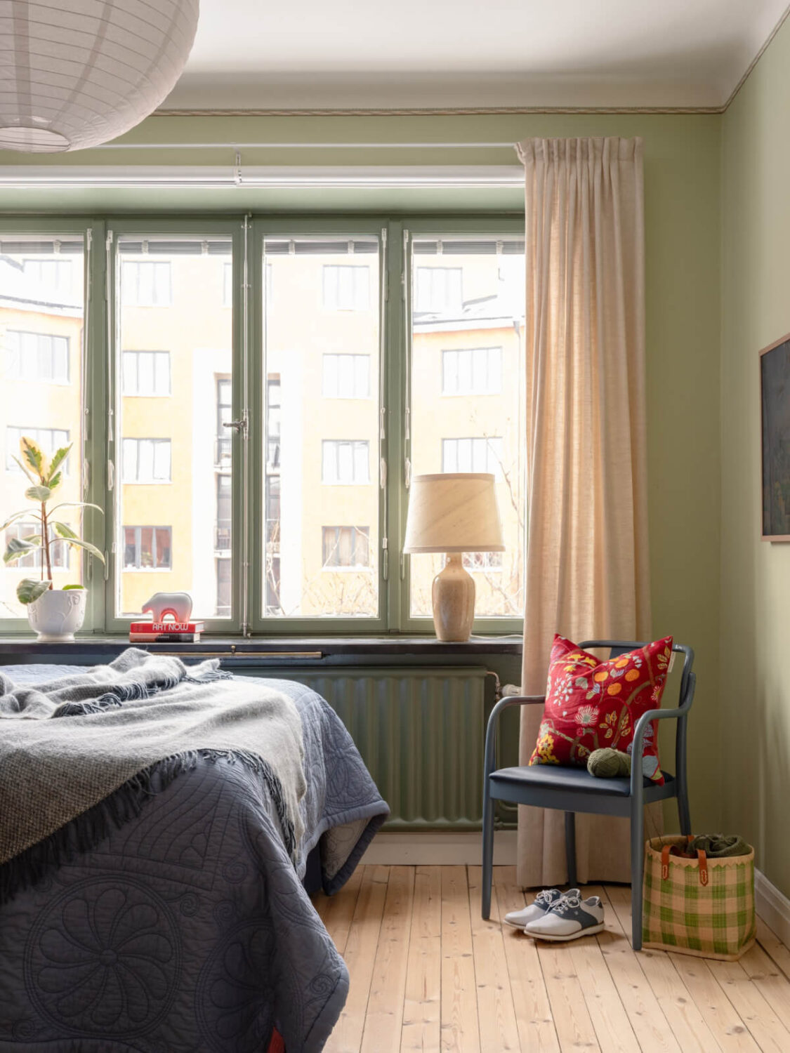A Beautiful Well-Preserved 1930s Apartment with a Blue Kitchen 17 green bedroom wooden floorboards
