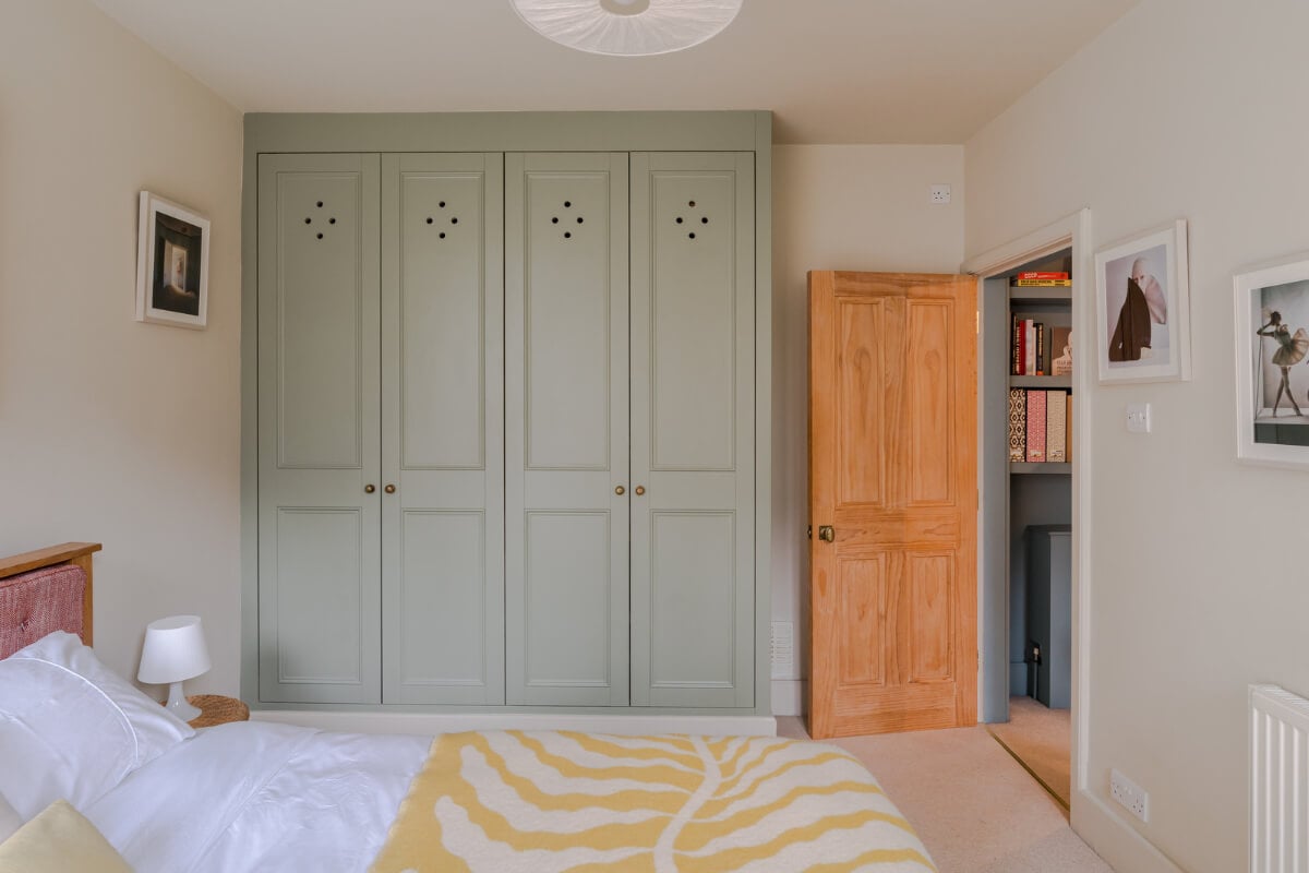 A Calm & Stylish Color Palette in a Small London Apartment 13 green built-in wardrobes beige bedroom