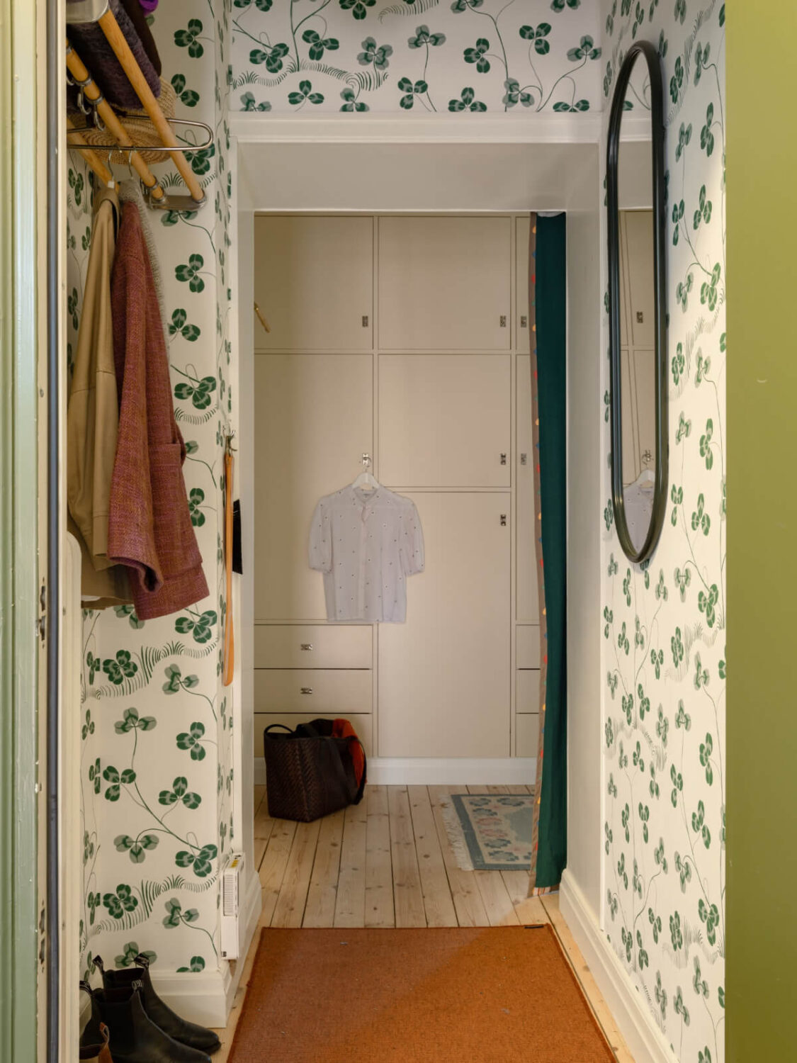 A Beautiful Well-Preserved 1930s Apartment with a Blue Kitchen 23 green clover wallpaper hallway