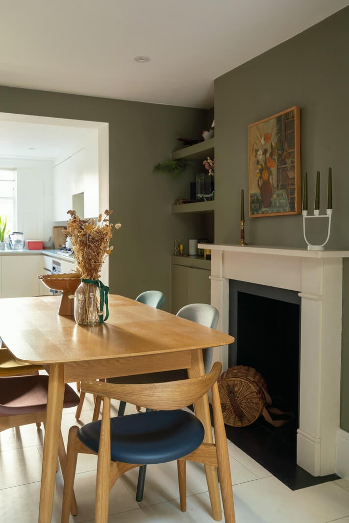 Contemporary Interiors and Preserved Details in an Early Victorian House 7 green dining room fireplace