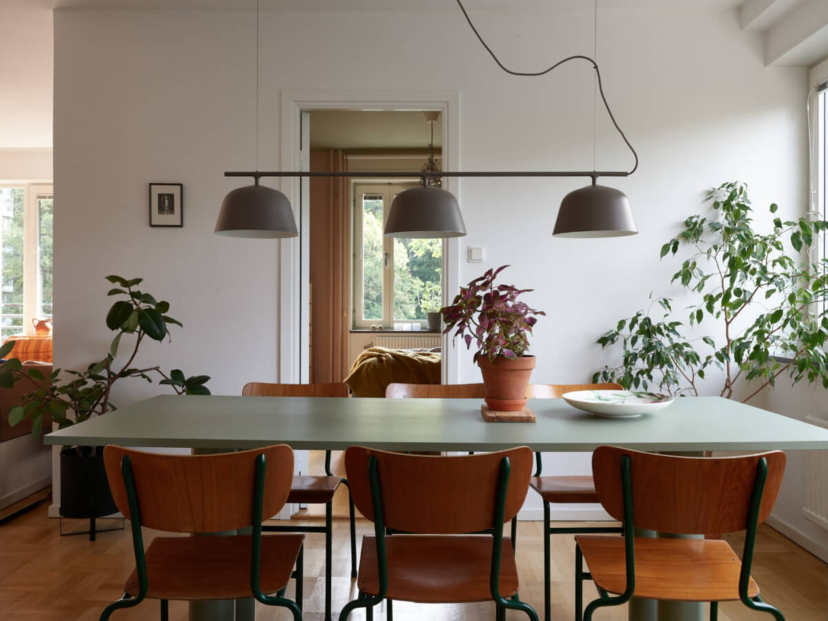 A Lovely Color Palette in a Midcentury Apartment in Sweden 10 green dining table