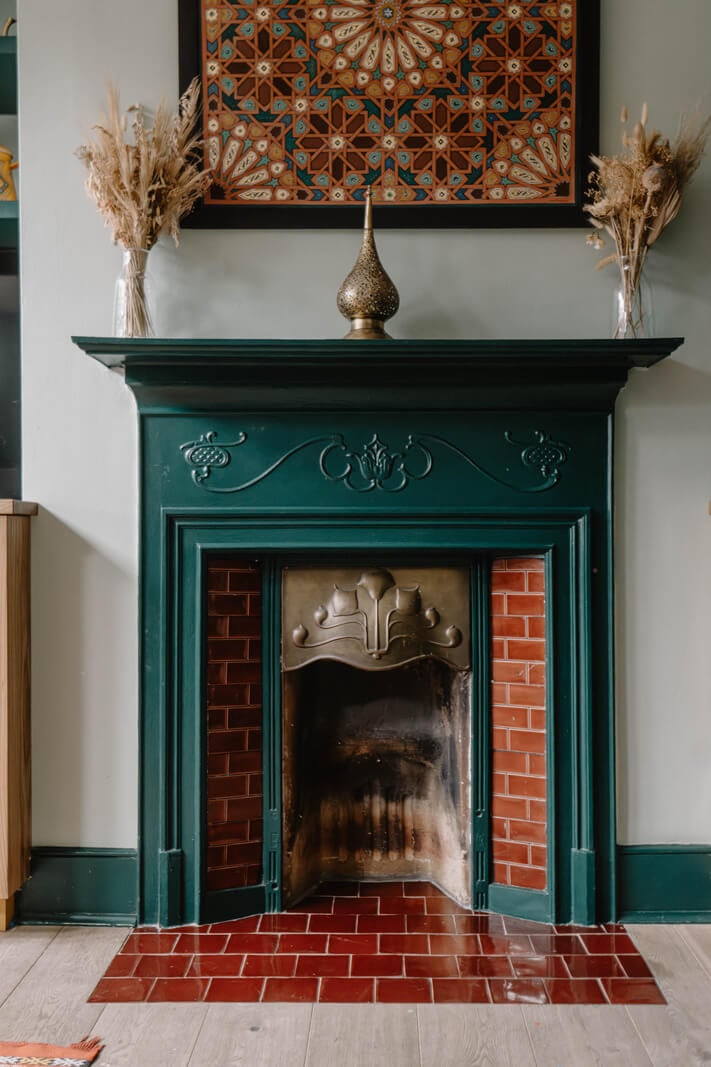 Moroccan-Inspired Designs in a Unique Artist Family Home in London 15 green fireplace red tiles