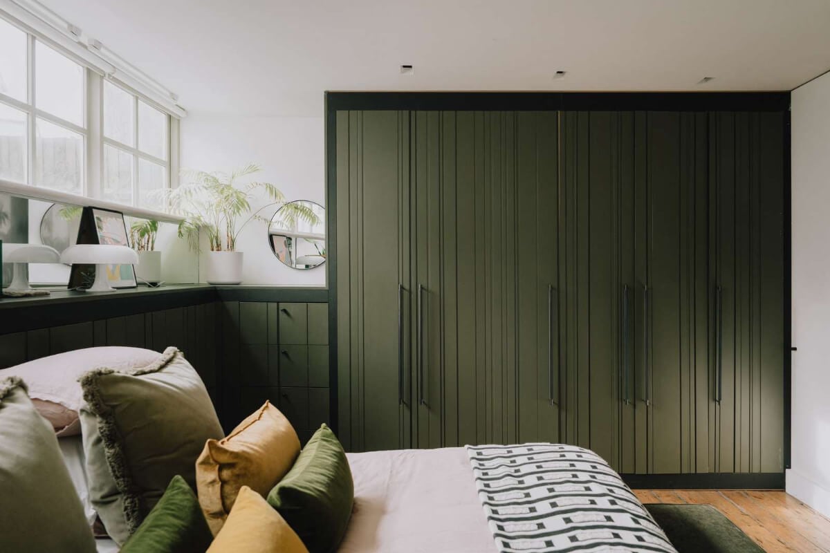 A London Basement Apartment in a Former Wood Workshop 17 green floor-to-ceiling wardrobes