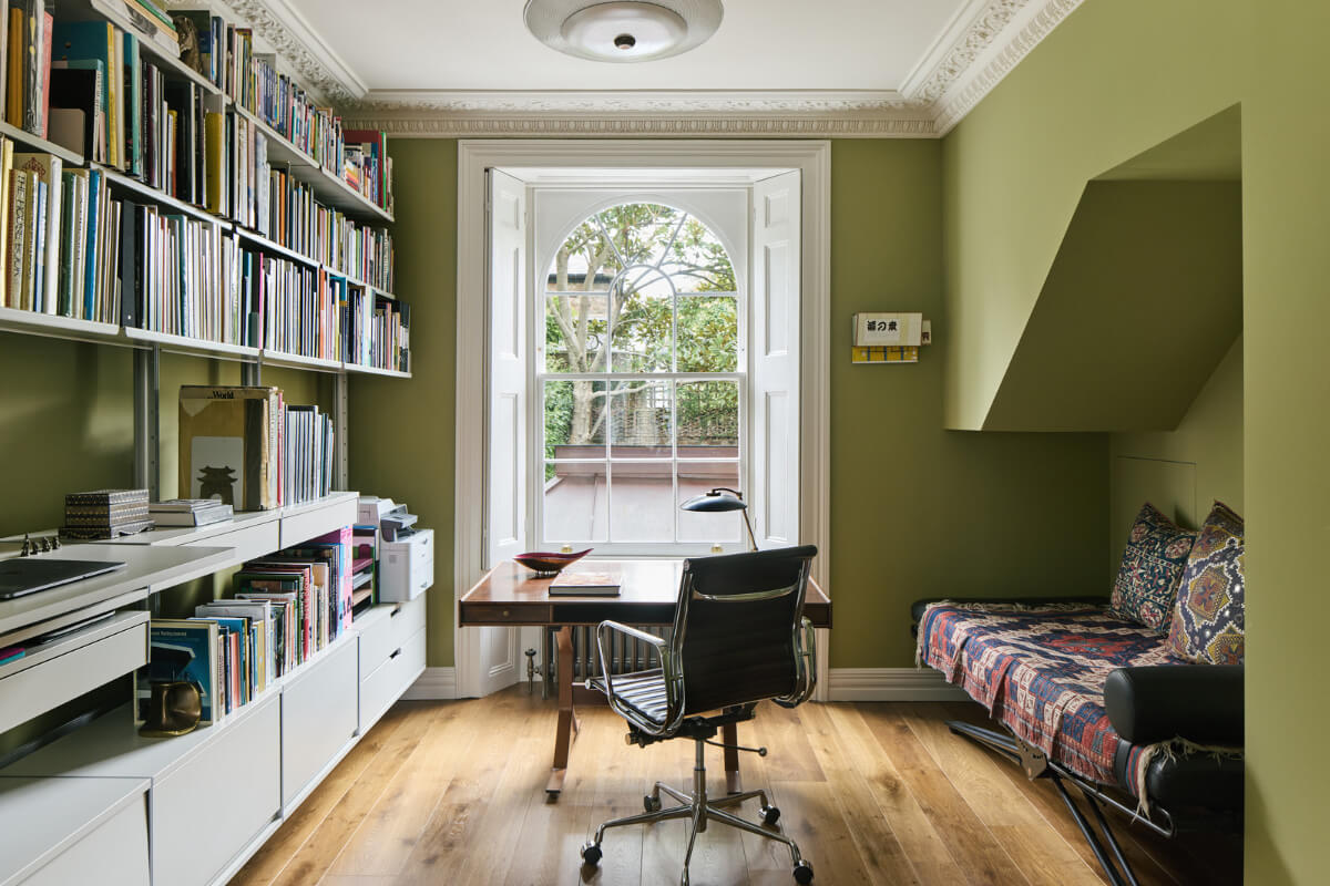 A Renovated Early Victorian Townhouse Decorated in Green Tones 10 green home office with bookshelves