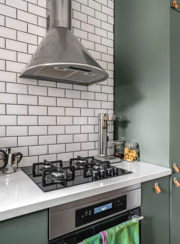 A Small Light-Filled Apartment with a Pink Bedroom 15 green kitchen light worktop