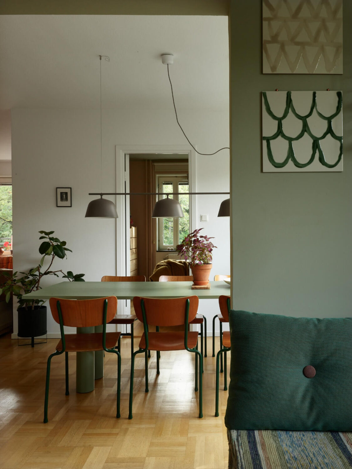 A Lovely Color Palette in a Midcentury Apartment in Sweden 14 green kitchen view into open plan living room