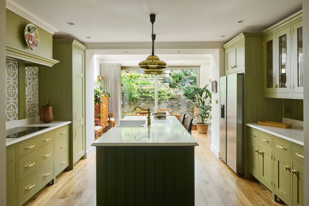A Renovated Early Victorian Townhouse Decorated in Green Tones 2 green kitchen with island