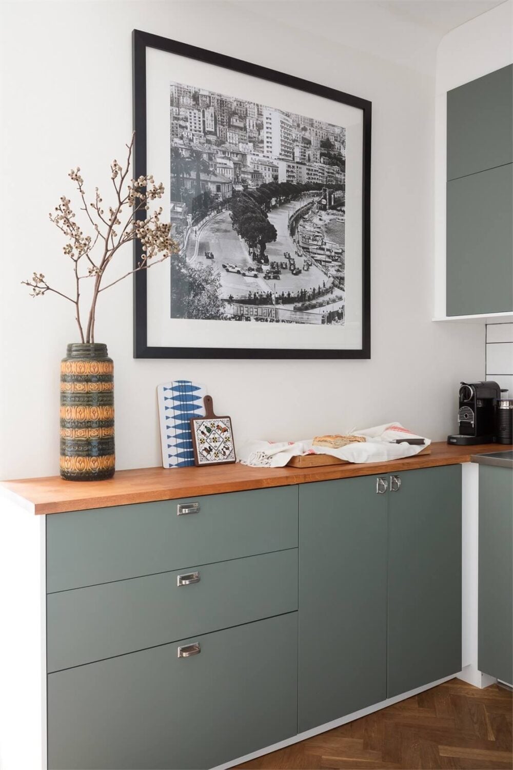 A Small Open-Plan Apartment with Midcentury Furniture 11 green kitchen wooden countertop