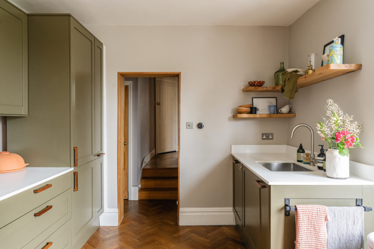 A Charming Garden Apartment in a Victorian House 7 green kitchen wooden floor