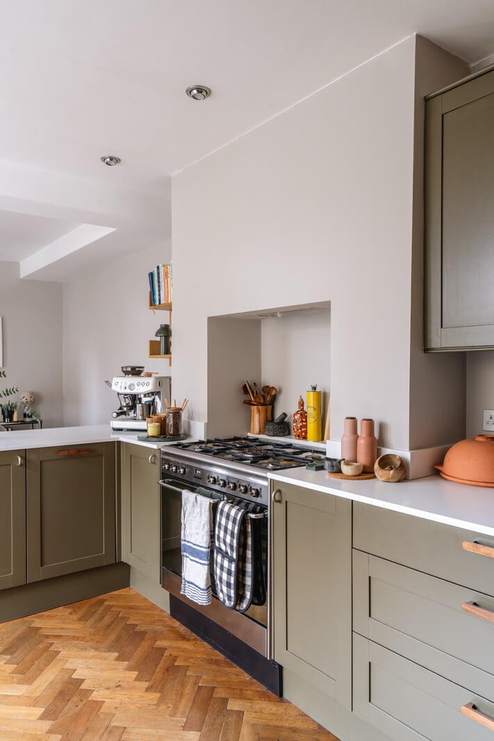 A Charming Garden Apartment in a Victorian House 6 green kitchen wooden handles