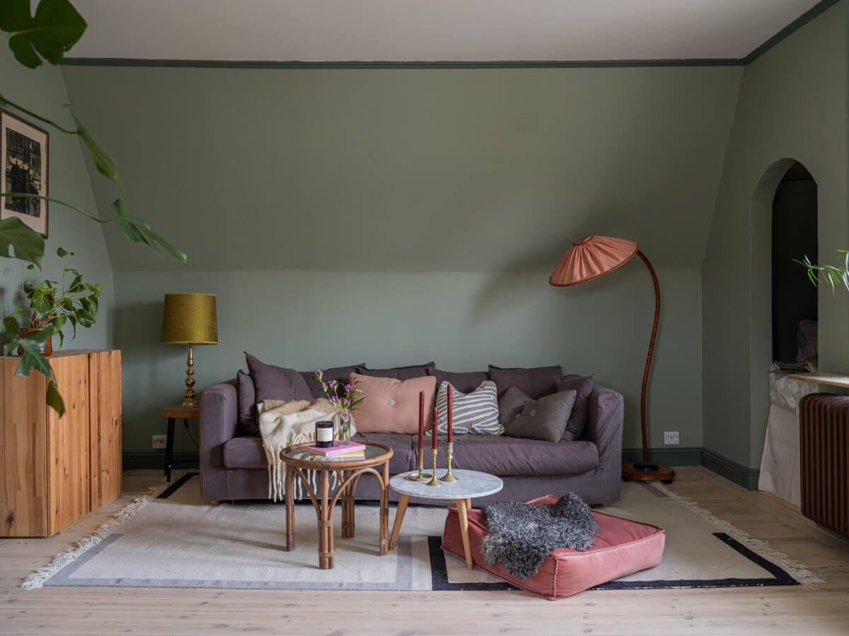 A 1920s Villa Pairs Modern Design and Period Features 19 green living room slanted ceiling