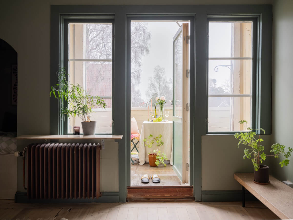 A 1920s Villa Pairs Modern Design and Period Features 23 green living room with large balcony