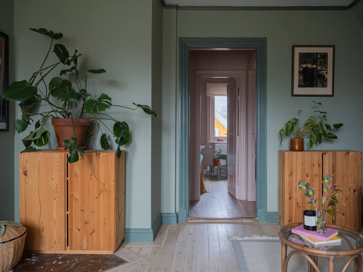 A 1920s Villa Pairs Modern Design and Period Features 25 green living room wooden floor