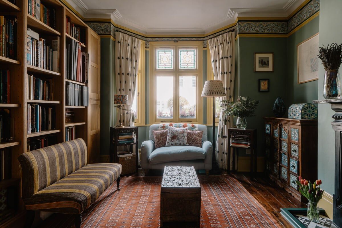 Moroccan-Inspired Designs in a Unique Artist Family Home in London 2 green sitting room yellow window frames bay window
