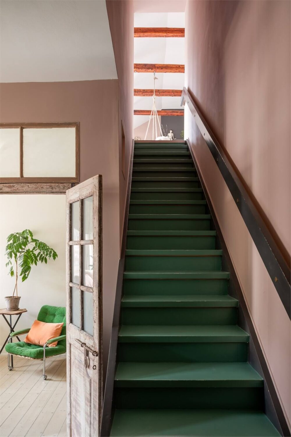 A Colorful Family Attic Apartment in Stockholm 34 green stairs pink walls