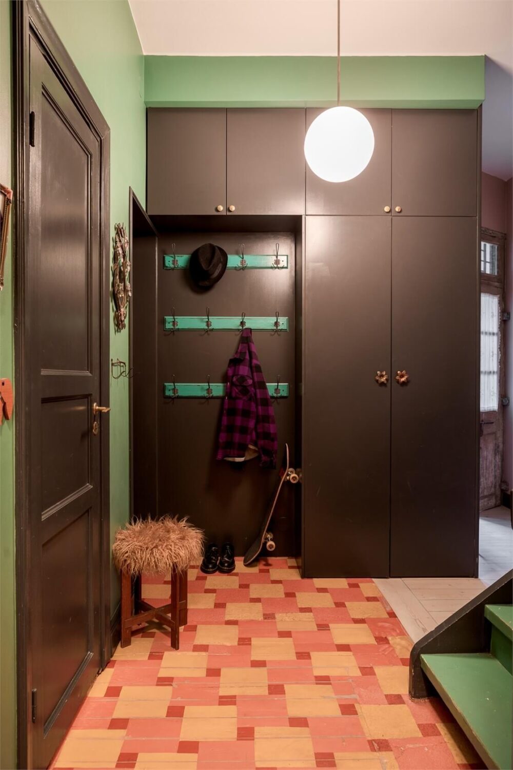 A Colorful Family Attic Apartment in Stockholm 47 hall black built-in cabinets