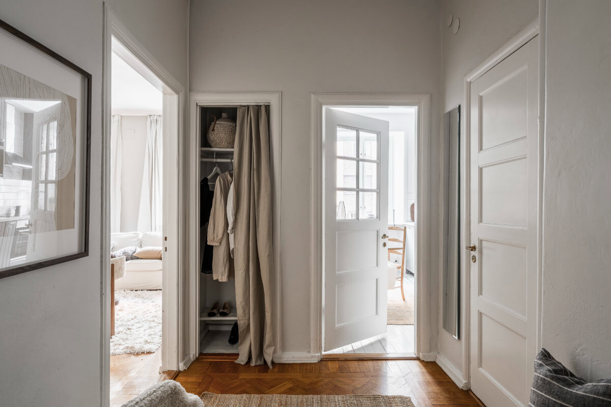 A Light Swedish Studio in an Early 20th Century Building 20 hall built-in wardrobe curtain