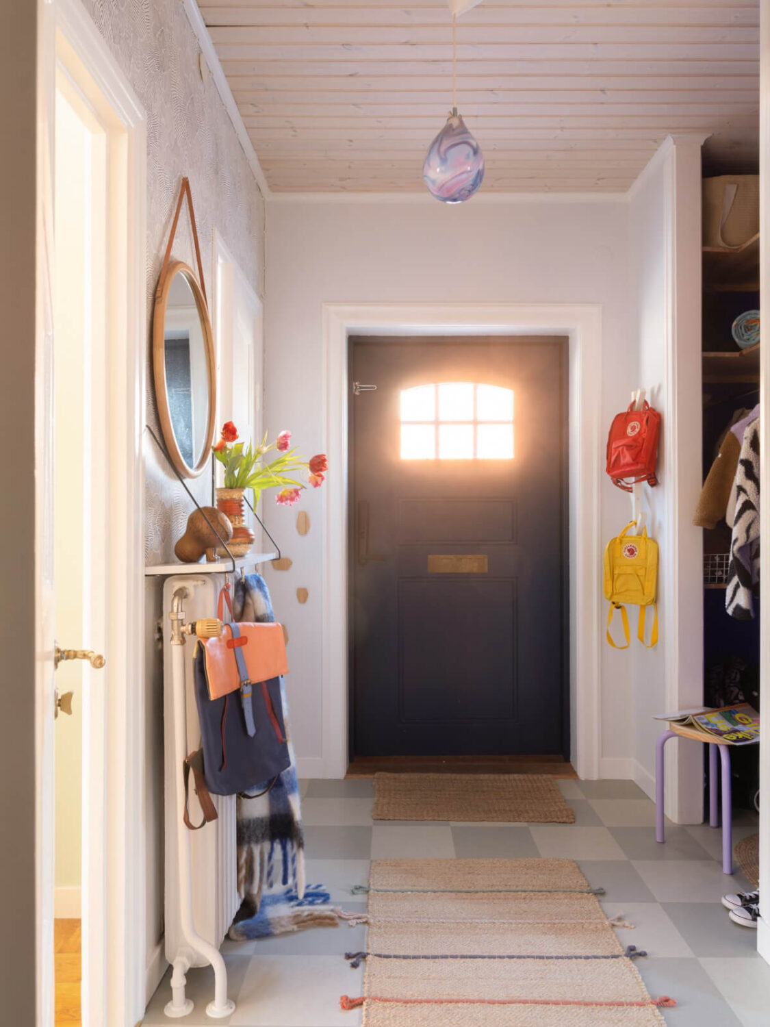 Colorful Decor in a Charming Family Duplex Apartment in Stockholm 32 hall checkerboard floor