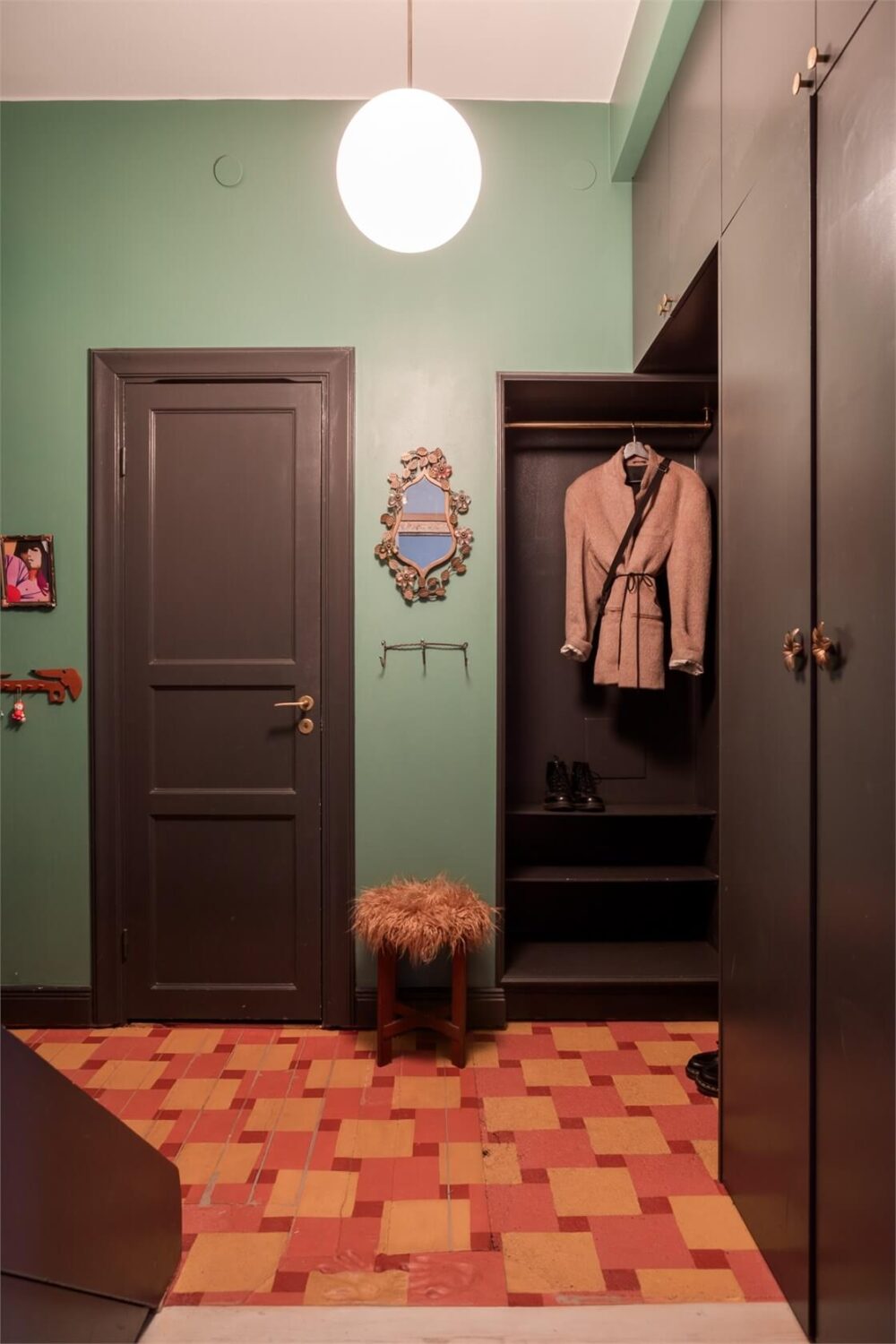A Colorful Family Attic Apartment in Stockholm 45 hall colorful floor black built-in wardrobes