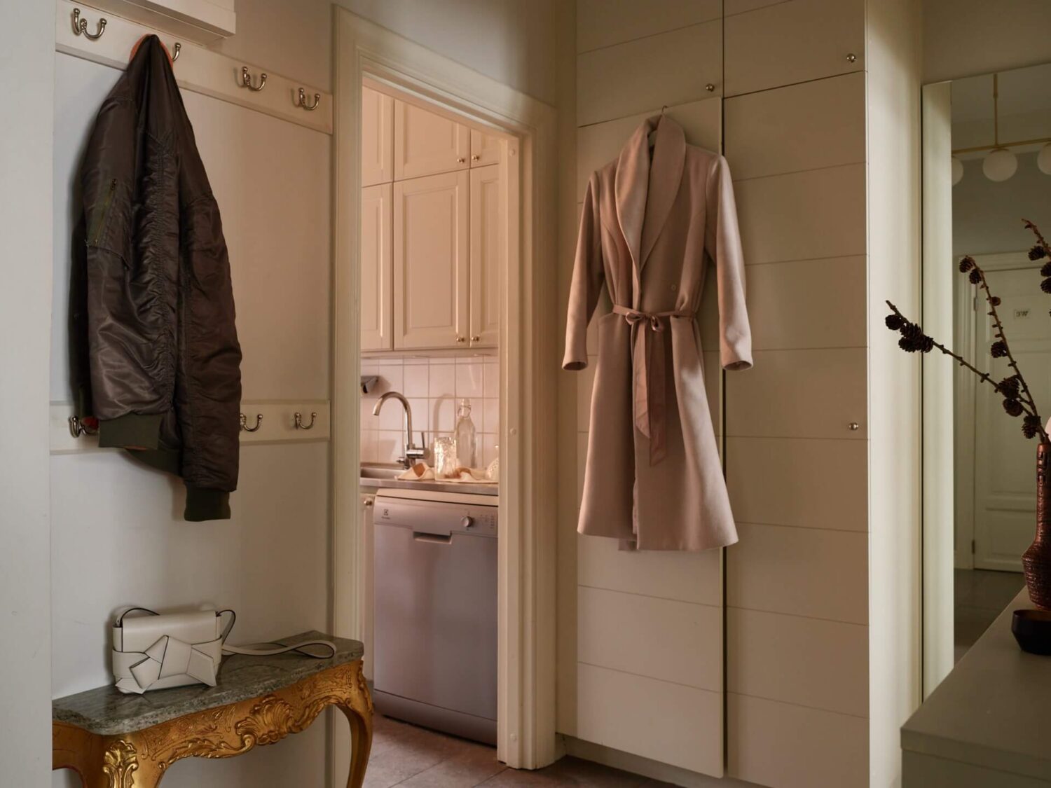 A Calm Gray Color Palette in a Charming Stockholm Apartment 17 hall floor to ceiling wardrobes
