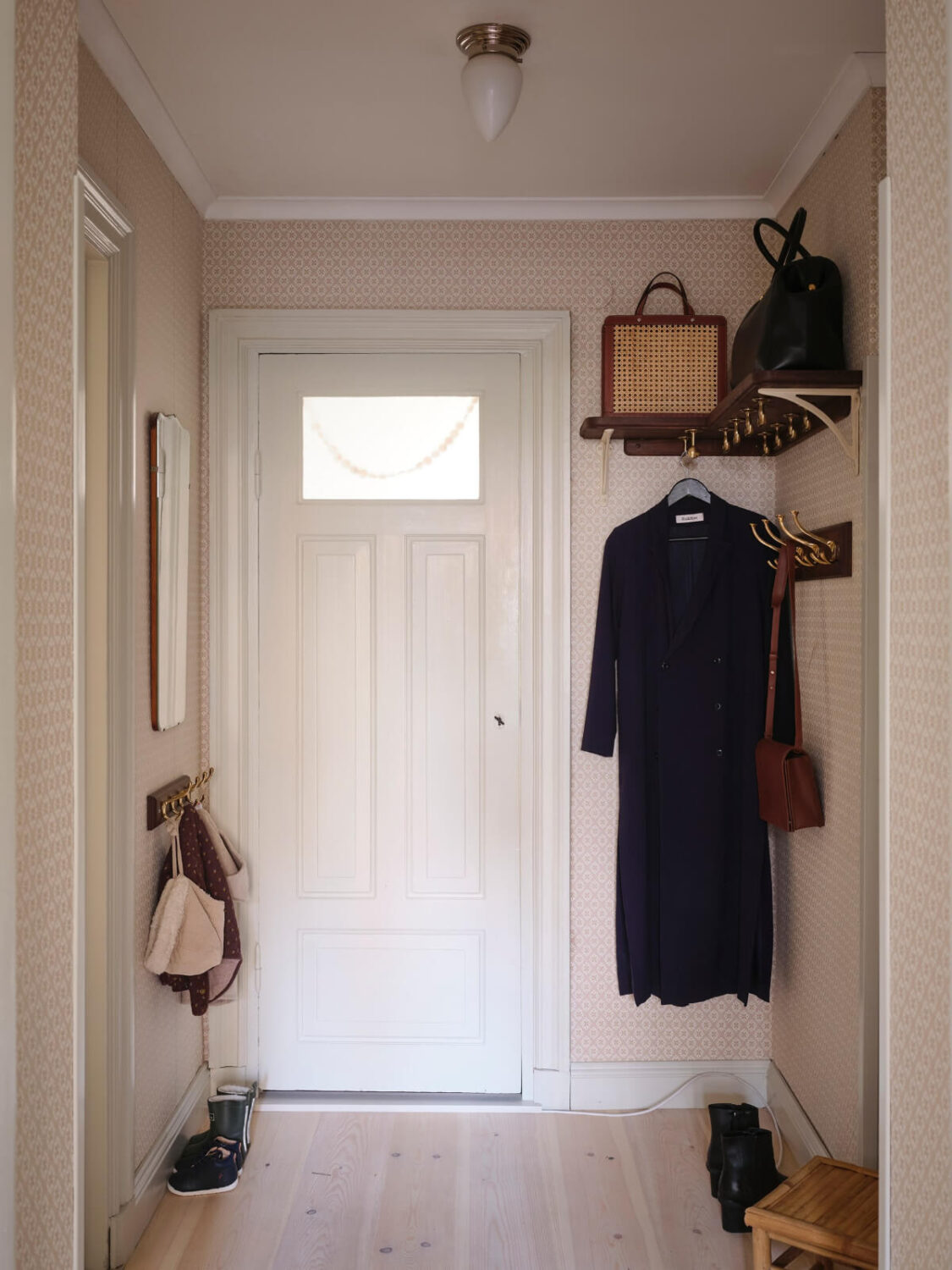 A Charming Vintage Apartment with Historic Wallpapers in Stockholm 20 hall hat shelf with coat storage
