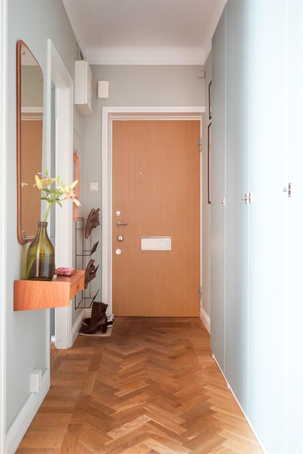 A Small Open-Plan Apartment with Midcentury Furniture 17 hall parquet floor wardrobes shoe storage