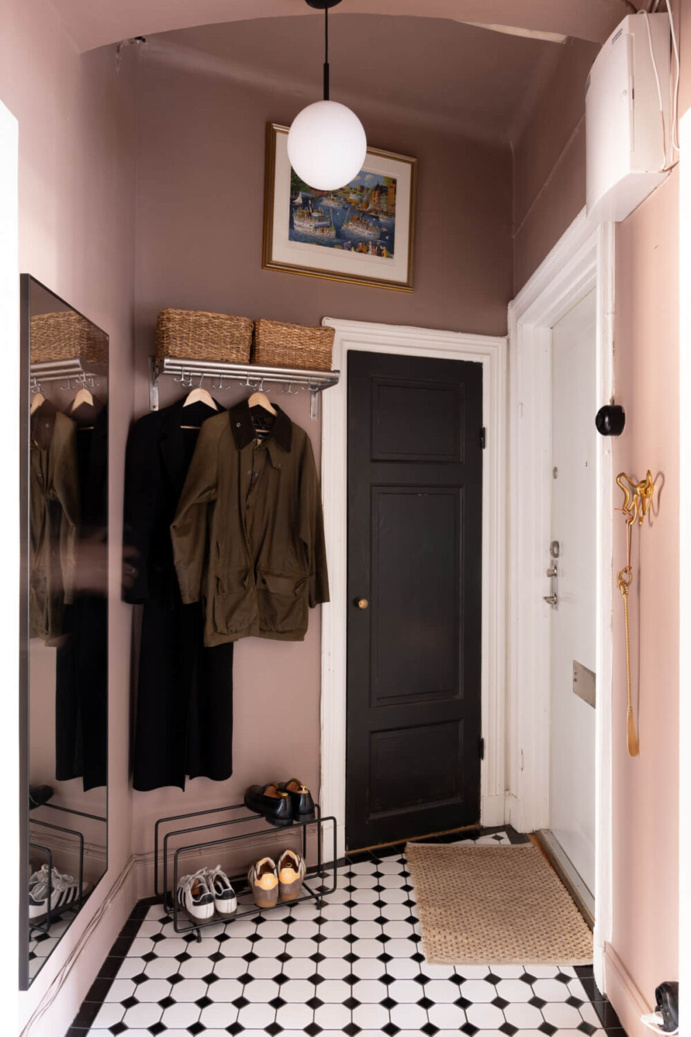 A Small Apartment Decorated in a Light Gray & White Color Palette 23 hall victorian style floor tiles pink walls