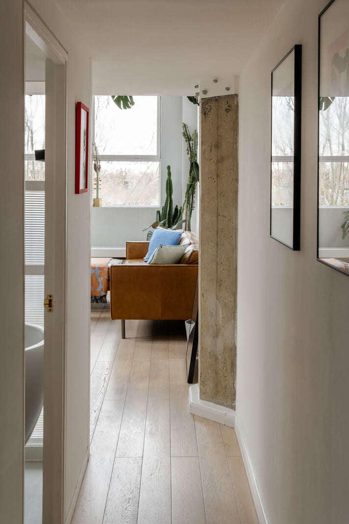 A Plant-Filled Loft Apartment in a Former Clothing Factory 7 hall view into living space