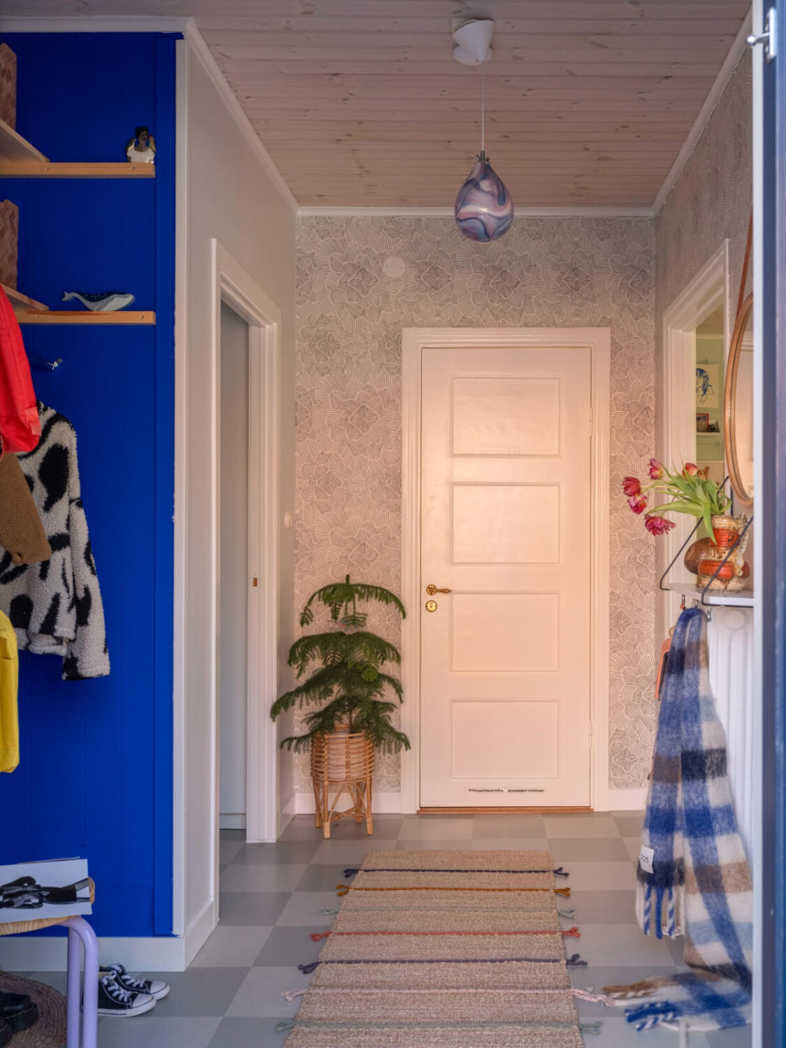 Colorful Decor in a Charming Family Duplex Apartment in Stockholm 30 hall wallpaper checkerboard floor