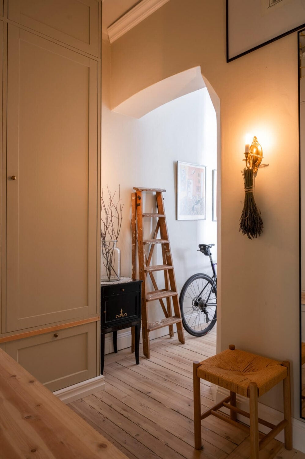 A Cozy Small Apartment with Period Features and Lots of Storage 24 hall with open doorway built-in wardrobes