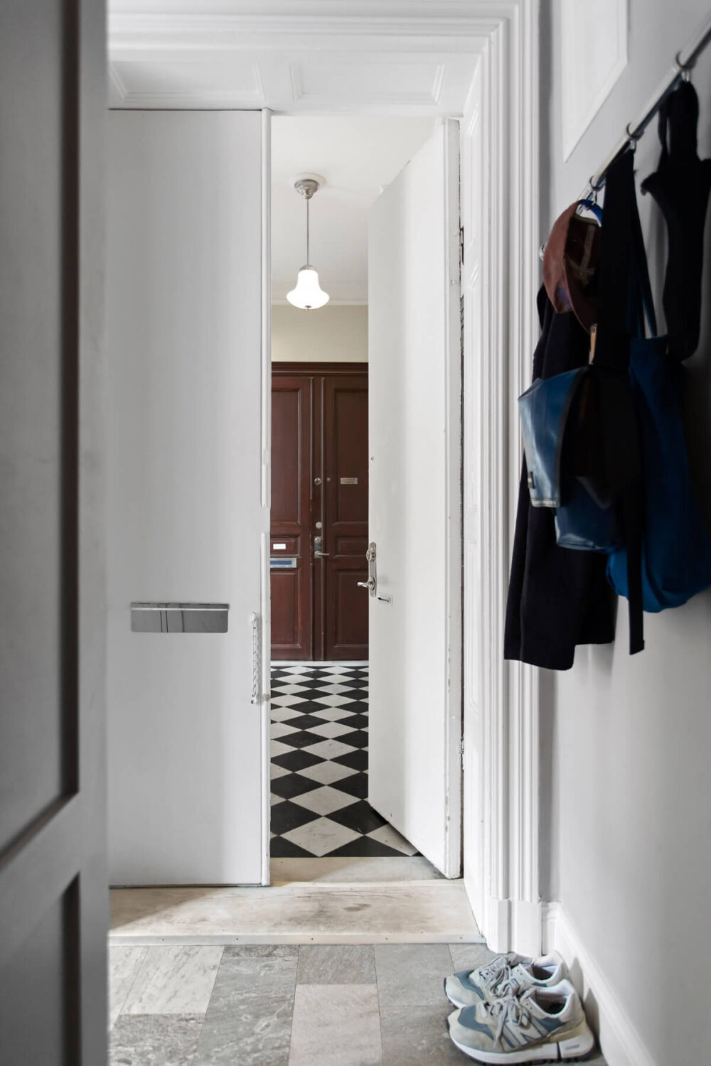 A Gray Studio Apartment with an Industrial Room Divider 17 hallway stone floor A Gray Studio Apartment with an Industrial Room Divider