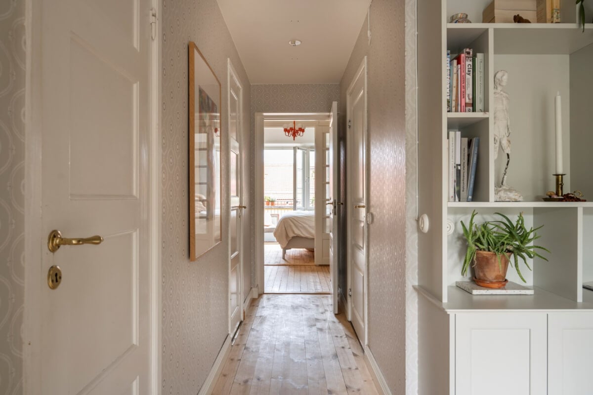 A Light Swedish Apartment with a Green Living Room 16 hallway with wallpaper