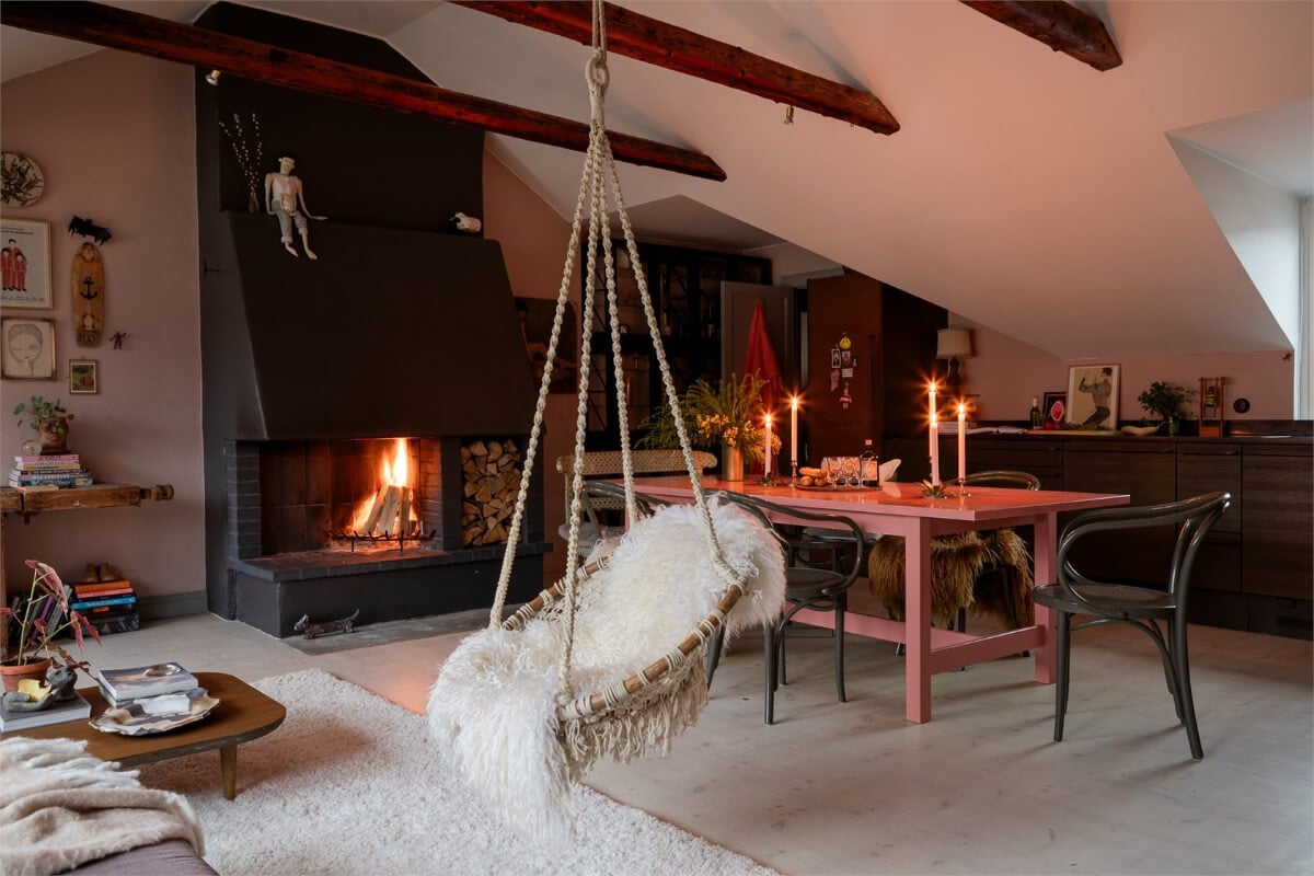 A Colorful Family Attic Apartment in Stockholm 12 hanging chair attic living space wooden beams