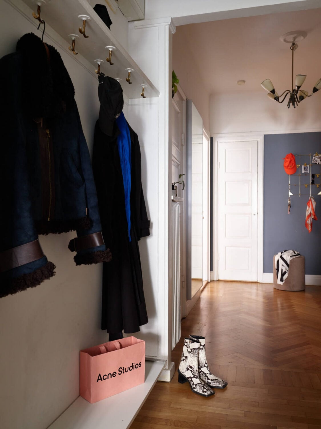 A Charming Small Apartment with a Fresh White Kitchen 21 hat shelf hall entry A Charming Small Apartment with a Fresh White Kitchen