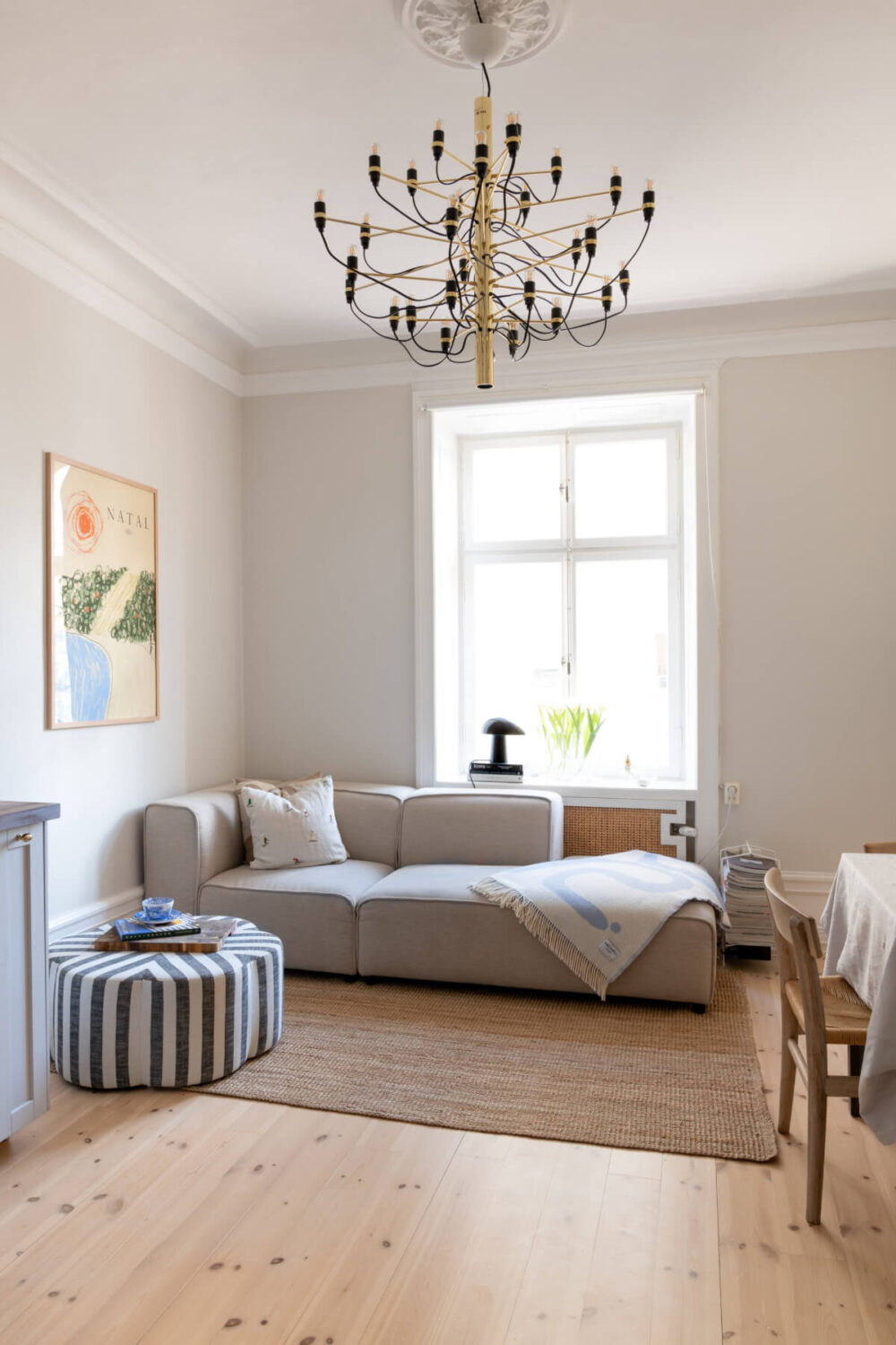 A Small Apartment Decorated in a Light Gray & White Color Palette 1 high ceilings wooden floor tiny living room