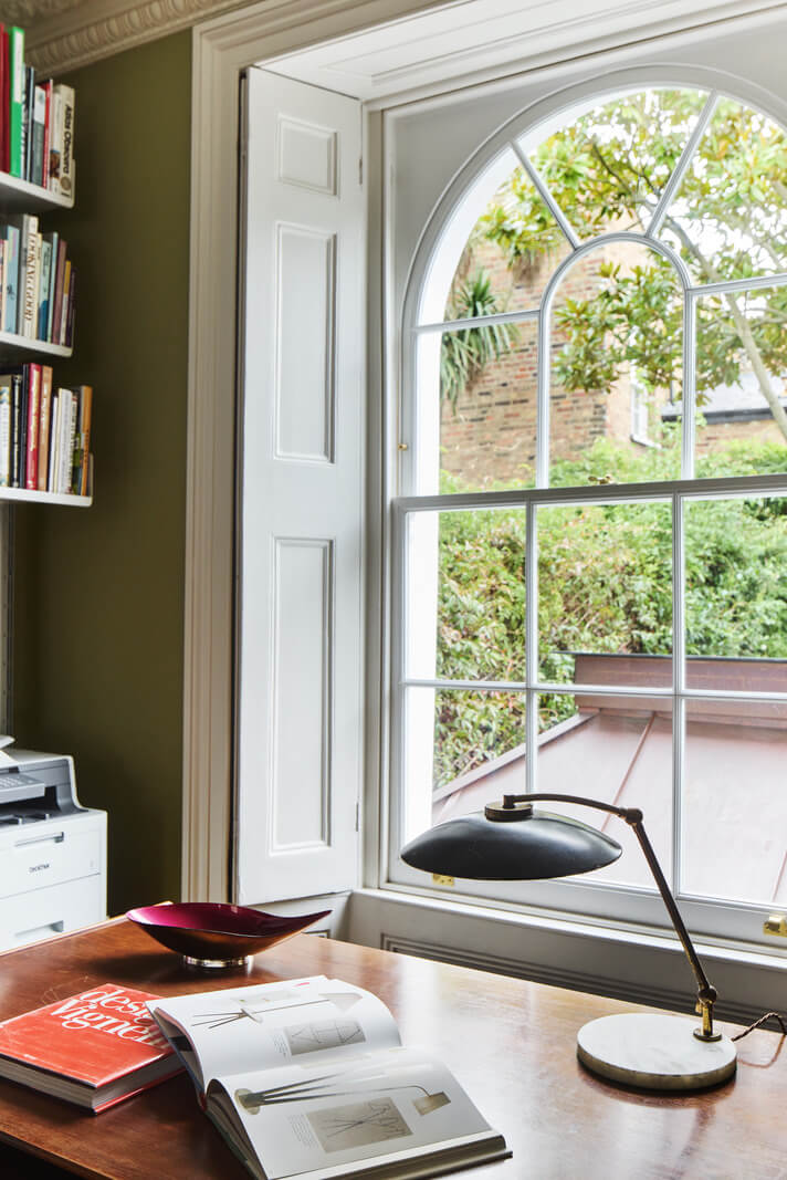 A Renovated Early Victorian Townhouse Decorated in Green Tones 11 home office arched window