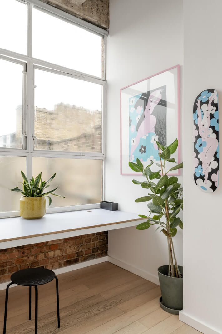 A Plant-Filled Loft Apartment in a Former Clothing Factory 15 home office brick wall