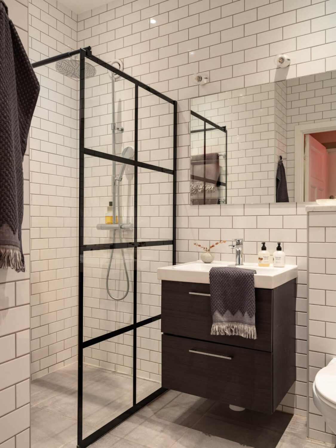 A Pink and Orange Bedroom in a Light Stockholm Apartment 23 industrial shower wall