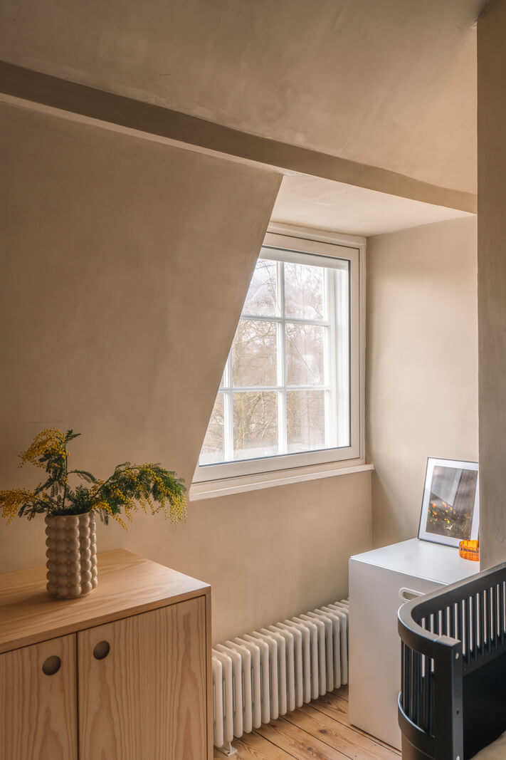 Contemporary Interiors in a Georgian Duplex Apartment in London 18 kids room slanted ceiling wooden floor