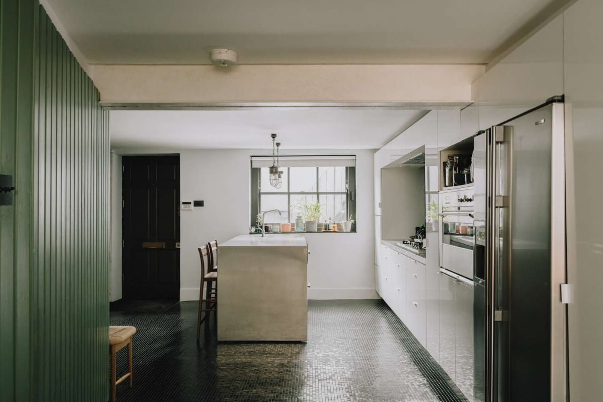 A London Basement Apartment in a Former Wood Workshop 11 kitchen dark mosaic floor tiles