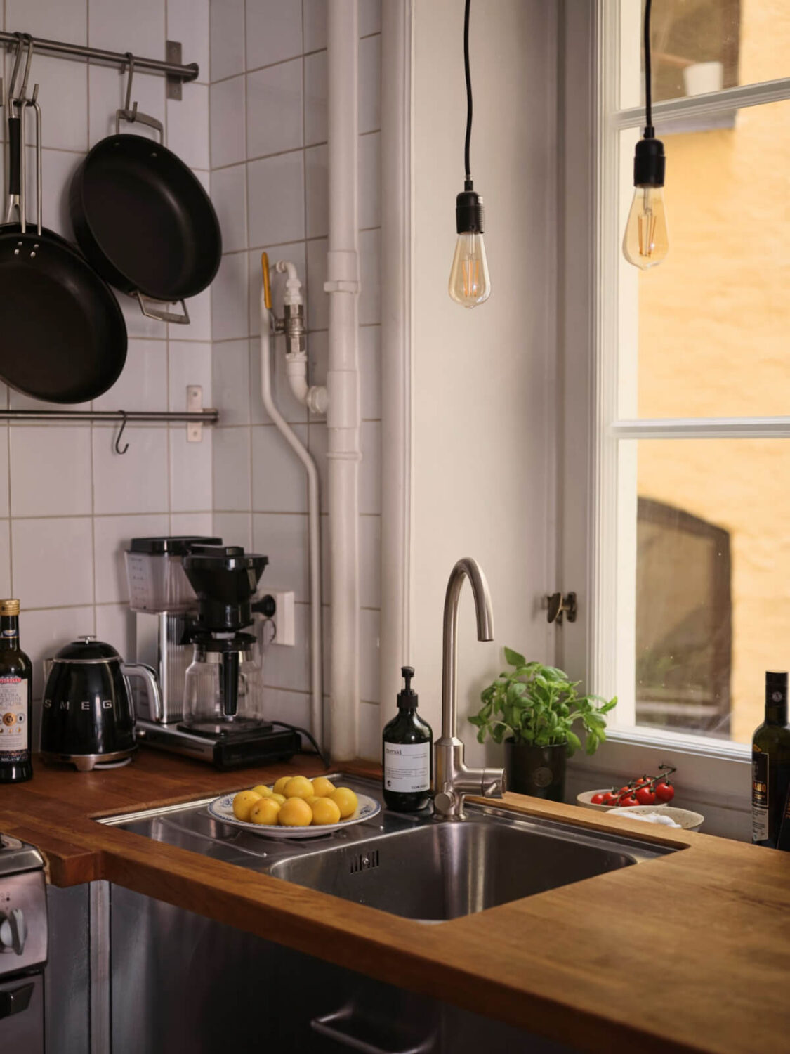A Small Apartment with an Industrial Stainless Steel Kitchen 11 kitchen detail