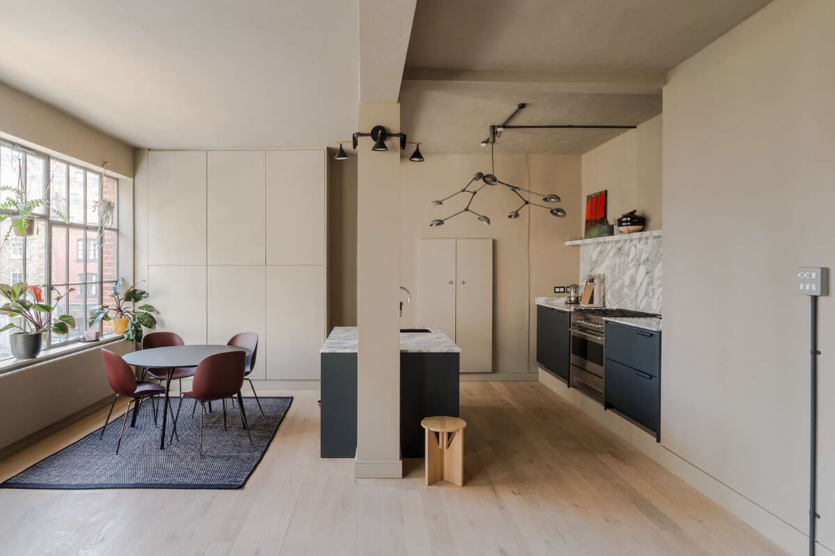 Soft-Colored Contemporary Interiors in a Warehouse Apartment 7 kitchen dining space large windows
