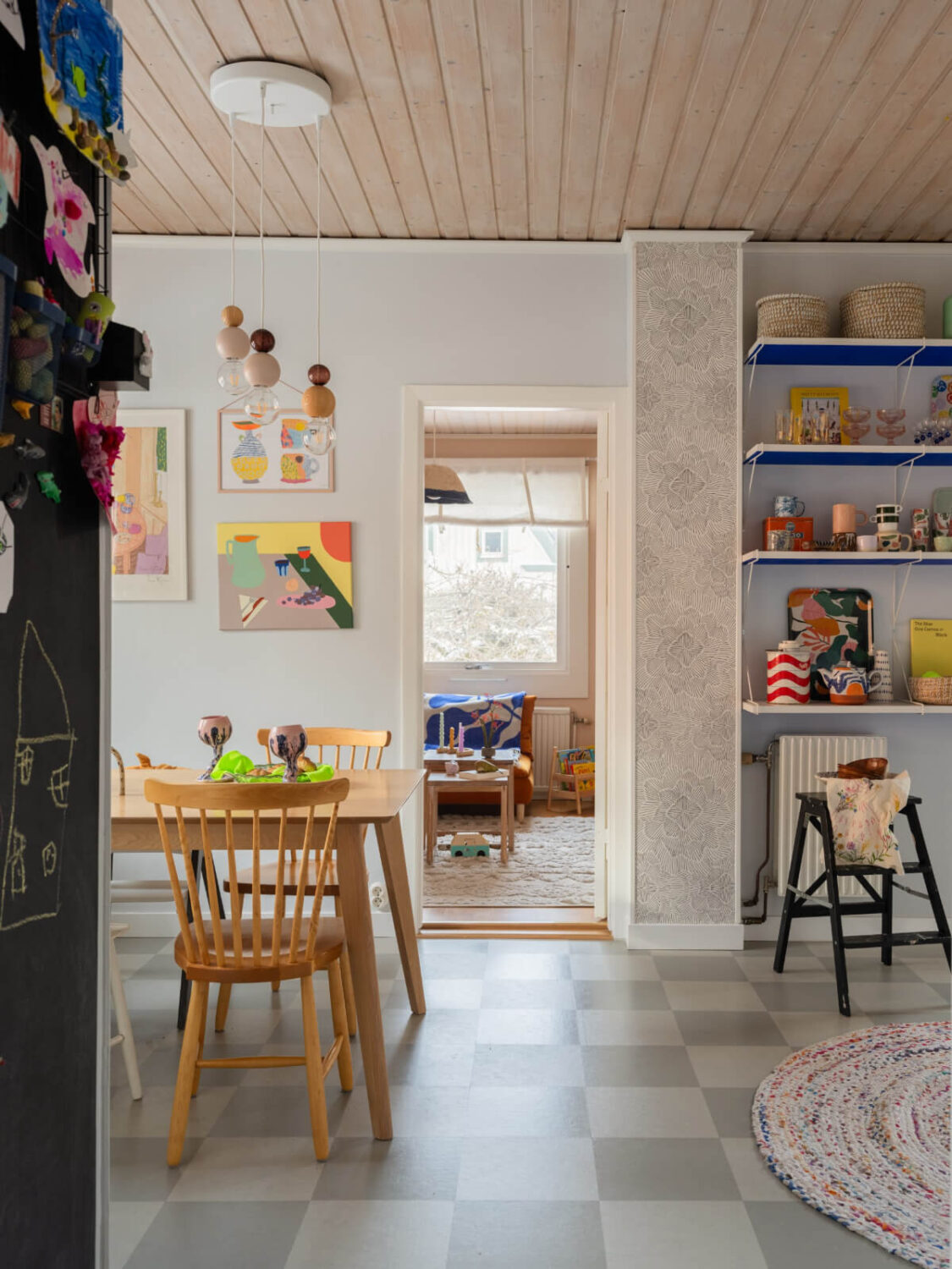 Colorful Decor in a Charming Family Duplex Apartment in Stockholm 10 kitchen dining table checkerboard floor